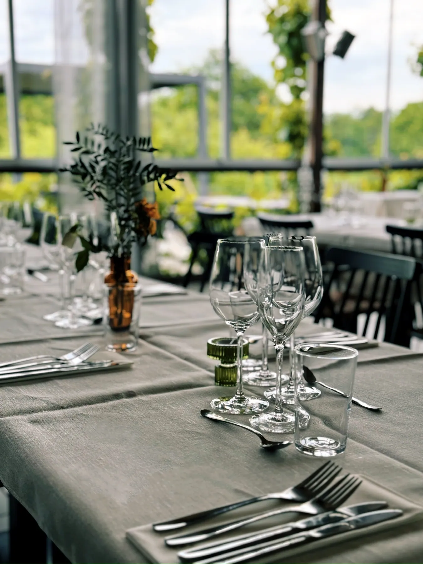 A wedding table laid with glasses and flowers